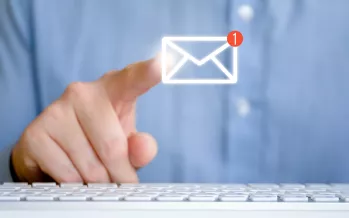 Finger pointing towards email icon