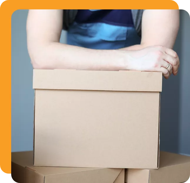 Mover leaning on a cardboard box