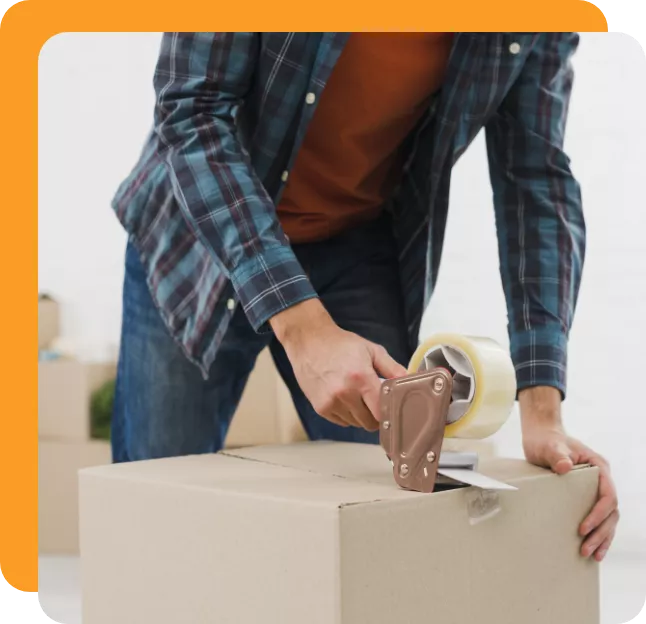 Man taping a cardboard box